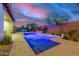 Stunning pool area with landscape lighting, providing a relaxing and picturesque backyard experience at 4330 S Neutron --, Mesa, AZ 85212