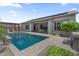 Inviting backyard pool with patio, dining area, and pergola, perfect for outdoor living at 4330 S Neutron --, Mesa, AZ 85212