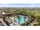 Community pool complex, featuring palm trees, inviting swimming pools, sun loungers, and plenty of space for relaxation and fun at 4330 S Neutron --, Mesa, AZ 85212