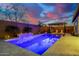 Backyard pool with water feature, pergola, and lounge chairs, perfect for outdoor relaxation at 4330 S Neutron --, Mesa, AZ 85212