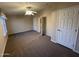 Spacious bedroom with neutral carpet, a ceiling fan, and a bright window at 437 E Germann Rd # 152, San Tan Valley, AZ 85140