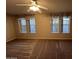 Spacious bedroom with neutral tones and two bright windows at 437 E Germann Rd # 152, San Tan Valley, AZ 85140