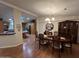 Elegant dining room with hardwood floors, chandelier, and traditional furnishings at 437 E Germann Rd # 152, San Tan Valley, AZ 85140