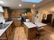 Bright eat-in kitchen with skylight and stainless steel refrigerator at 437 E Germann Rd # 152, San Tan Valley, AZ 85140