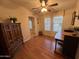 This living room features wood flooring and a decorative armoire, with plenty of natural light from the window at 437 E Germann Rd # 152, San Tan Valley, AZ 85140