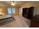 Bright main bedroom with a ceiling fan, natural light, a large closet, and neutral walls at 437 E Germann Rd # 152, San Tan Valley, AZ 85140