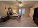 Cozy main bedroom featuring carpet, natural light, a ceiling fan, and neutral tones at 437 E Germann Rd # 152, San Tan Valley, AZ 85140