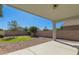 Covered patio and landscaping in the spacious backyard at 43945 W Juniper Ave, Maricopa, AZ 85138