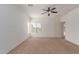 Spacious bedroom with carpeted floors and a ceiling fan at 43945 W Juniper Ave, Maricopa, AZ 85138