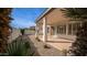 A covered patio is framed by lush landscaping and desert plants in this private backyard oasis at 4831 E Annette Dr, Scottsdale, AZ 85254