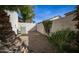 Enclosed backyard featuring rock landscaping with mature trees and bushes, providing a private outdoor retreat at 4831 E Annette Dr, Scottsdale, AZ 85254