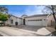 Inviting single-story home with a two-car garage, landscaped yard and sidewalk at 4831 E Annette Dr, Scottsdale, AZ 85254