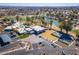 Aerial view of community amenities including a pool, tennis courts, and picturesque water features at 4843 E Ajo Cir, Phoenix, AZ 85044