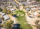 Bird's eye view of a green golf course surrounded by houses, and trees at 4843 E Ajo Cir, Phoenix, AZ 85044