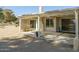 Spacious back patio with a covered area, perfect for outdoor relaxing and entertaining at 4843 E Ajo Cir, Phoenix, AZ 85044