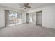 Spacious bedroom with mirrored closet doors and large sliding glass door to backyard at 4843 E Ajo Cir, Phoenix, AZ 85044