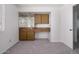 Bedroom with built-in desk/cabinet space, mirrored backsplash, and door to connecting room at 4843 E Ajo Cir, Phoenix, AZ 85044