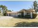 Charming single-story home featuring a terra cotta tile roof, attached garages, and a well-manicured lawn at 4843 E Ajo Cir, Phoenix, AZ 85044