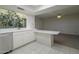 Bright kitchen with bar top and a view of the outdoor garden area at 4843 E Ajo Cir, Phoenix, AZ 85044