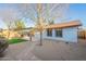 Backyard view highlighting the patio, desert landscaping, and well-maintained exterior of the home at 4932 W Golden Ln, Glendale, AZ 85302