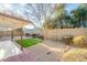 Relaxing backyard with a covered patio, desert landscape design, and mature trees providing shade at 4932 W Golden Ln, Glendale, AZ 85302