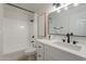 Modern bathroom featuring white tile, and an integrated shower and tub at 4932 W Golden Ln, Glendale, AZ 85302