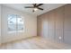 A neutral toned bedroom featuring a unique square wainscotting design at 4932 W Golden Ln, Glendale, AZ 85302