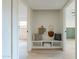 Hallway with a built in storage bench and modern decor at 4932 W Golden Ln, Glendale, AZ 85302