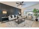 Cozy living room with an accent wall, stylish furniture, and a neutral-toned rug at 4932 W Golden Ln, Glendale, AZ 85302