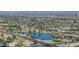 Beautiful aerial view featuring a serene lake surrounded by homes and lush green spaces at 4950 N Miller Rd # 119, Scottsdale, AZ 85251