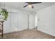 Bright bedroom with a ceiling fan and double closets, featuring an inviting layout at 4950 N Miller Rd # 119, Scottsdale, AZ 85251