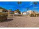 El Chaparral community entrance sign, surrounded by desert landscaping and palm trees at 4950 N Miller Rd # 119, Scottsdale, AZ 85251