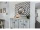 Stylish dining area features a decorative backsplash, modern lighting, and white cabinetry at 4950 N Miller Rd # 119, Scottsdale, AZ 85251