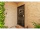 A welcoming front door with a decorative wreath, and a charming entry for unit 119 at 4950 N Miller Rd # 119, Scottsdale, AZ 85251