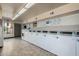 Clean laundry room featuring multiple machines and a large folding table at 4950 N Miller Rd # 119, Scottsdale, AZ 85251