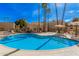 Enjoy a large community pool, perfect for relaxation, with ample seating and sunny skies overhead at 4950 N Miller Rd # 119, Scottsdale, AZ 85251