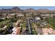 Scenic aerial view of a Phoenix neighborhood featuring lush landscaping, a golf course, and mountain views at 5223 N 24Th St # 108, Phoenix, AZ 85016