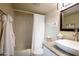 Well-lit bathroom with granite countertop, vessel sink, and shower with curtain at 5223 N 24Th St # 108, Phoenix, AZ 85016