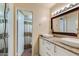 Bathroom features dual vessel sinks, granite counters, framed mirror, and shower at 5223 N 24Th St # 108, Phoenix, AZ 85016