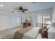 Serene bedroom with a ceiling fan, bright windows, and a neutral color scheme at 5223 N 24Th St # 108, Phoenix, AZ 85016