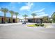 Community clubhouse entrance with beautiful architectural details and landscaping at 5223 N 24Th St # 108, Phoenix, AZ 85016