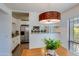 Bright dining room with views into the kitchen and stainless steel appliances at 5223 N 24Th St # 108, Phoenix, AZ 85016