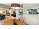 Cozy dining area showcasing a modern light fixture with a view into the living room and kitchen at 5223 N 24Th St # 108, Phoenix, AZ 85016