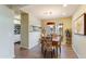 Bright dining room with a decorative light fixture and large window for abundant natural light at 5223 N 24Th St # 108, Phoenix, AZ 85016