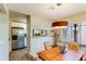 Bright dining room featuring a pendant light fixture and views of the stainless steel kitchen appliances at 5223 N 24Th St # 108, Phoenix, AZ 85016