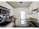 Efficient kitchen with stainless steel appliances, black and silver backsplash, and lots of light at 5223 N 24Th St # 108, Phoenix, AZ 85016