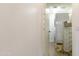 Inside laundry room featuring newer washer and dryer units, shelves and laminate flooring at 5223 N 24Th St # 108, Phoenix, AZ 85016