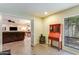 Bright living room featuring an antique desk and a leather sofa in the background at 5223 N 24Th St # 108, Phoenix, AZ 85016