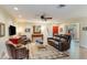 Comfortable living room with a leather sofa, ceiling fan, and a stylish rug creates an inviting ambiance at 5223 N 24Th St # 108, Phoenix, AZ 85016