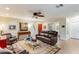 Inviting living room featuring a leather sofa, stylish chairs, and a decorative mirror adding character at 5223 N 24Th St # 108, Phoenix, AZ 85016